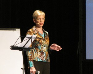 Mari Smith on stage at T. Harv Eker's Guerrilla Business School